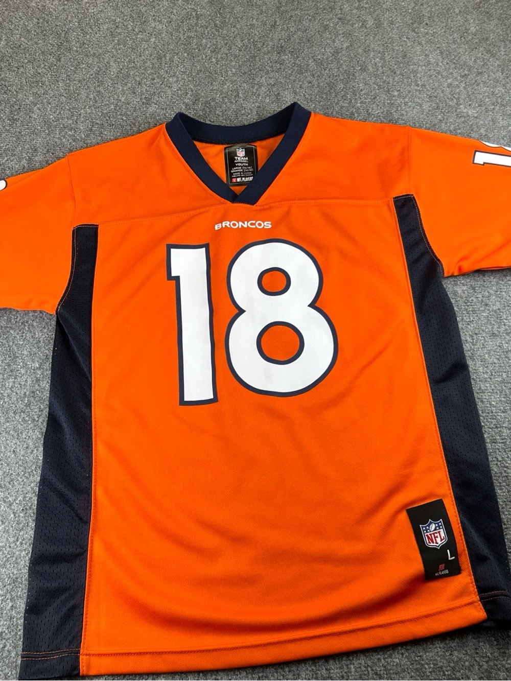 NFL Youth large Denver broncos manning Jersey in Orange and Navy